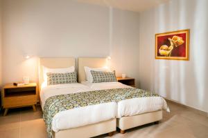 a bedroom with a large bed in a room at Eland Dream Villas in Kalamaki Chanion