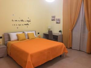 A bed or beds in a room at Color House Malpensa B&B