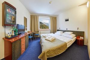 Postel nebo postele na pokoji v ubytování Hotel Horizont