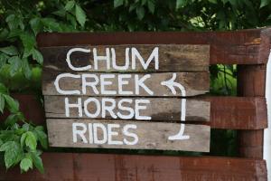 a sign that reads chim creek horse rides at Chum Creek Hut in Chum Creek