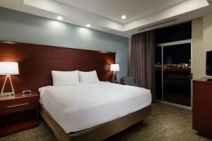 A bed or beds in a room at Staybridge Suites-Las Vegas