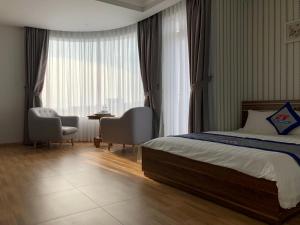 Postel nebo postele na pokoji v ubytování Ngoc Thanh Hotel + 28 fotografií