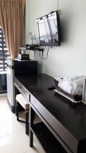 a black desk with a mirror on the wall at Admire House in Pattaya