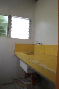 A kitchen or kitchenette at Casaoro Homestay