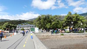 a group of people walking down a street at Akaroa Central Apartment in Akaroa