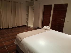 Postel nebo postele na pokoji v ubytování Orquidea GuestHouse Spa & Restaurant