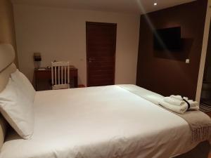Postel nebo postele na pokoji v ubytování Orquidea GuestHouse Spa & Restaurant