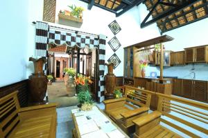 abyterian church with benches and a altar in a building at Quang Xuong Homestay in Hoi An