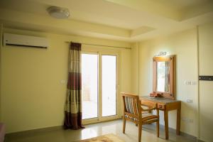 a room with a desk and a window and a chair at Florida Hotel North Coast in El Alamein