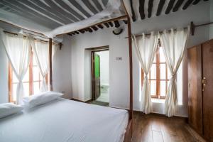 Katil atau katil-katil dalam bilik di Stone Town House