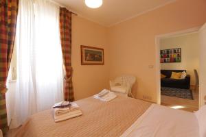 Ένα ή περισσότερα κρεβάτια σε δωμάτιο στο La casa della nonna sulla francigena