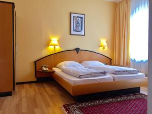 Postel nebo postele na pokoji v ubytování Hotel Kull von Schmidsfelden