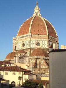 a large building with a red roof at Romantic apartment in the heart of Florence in Florence