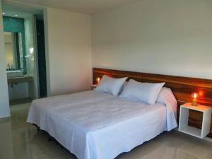 Postel nebo postele na pokoji v ubytování Barrancas Suites