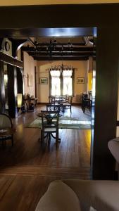 a large room with tables and chairs in a room at Villa Art Hotel Boutique in La Cumbre