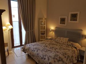 Postel nebo postele na pokoji v ubytování B&B Torrente Antico