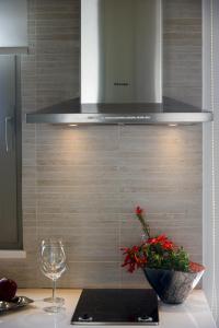 Virtuvė arba virtuvėlė apgyvendinimo įstaigoje Aurora Elegant Residence