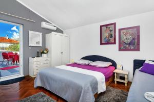 Posteľ alebo postele v izbe v ubytovaní Apartmani Maja