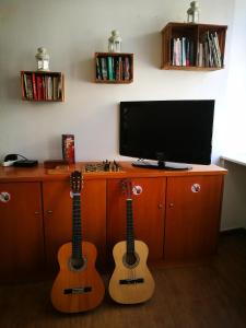 A television and/or entertainment center at Porto Downtown Hostel