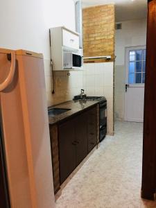 Kuchyň nebo kuchyňský kout v ubytování Casa Nuova Depto CERO