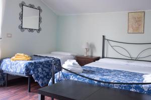 Katil atau katil-katil dalam bilik di Il Mulino