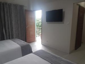 Postel nebo postele na pokoji v ubytování Orquidea GuestHouse Spa & Restaurant