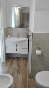 a bathroom with a sink and a toilet at Casa Ofelia in Levanto +11 photos