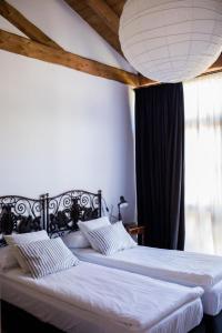 Giường trong phòng chung tại Corte Villa Donati