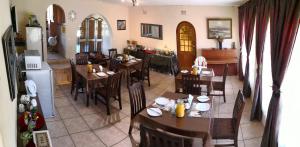 an overhead view of a restaurant with tables and chairs at All over Africa Guest house in Kempton Park