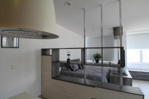 a bedroom with a bed and a glass wall at Boutique Apartment Downtown 1506 in Mexico City