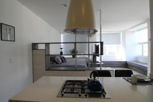 a kitchen with a tea kettle on top of a stove at Boutique Apartment Downtown 1506 in Mexico City