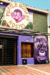 a building with a mural on the side of it at Purple Monkey Hostel in Medellín