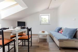 Zona de estar de Apartments Beach House Villa