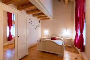 Cama o camas de una habitación en Locanda Viaverde Lessinia