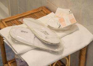 a pile of white shoes sitting on a table at Vernazza Vacation 2 in Vernazza +26 photos