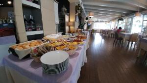 a buffet of food on a table in a restaurant at Hotel Ristorante Fortuna in Cavallino-Treporti
