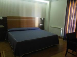 Postel nebo postele na pokoji v ubytování Hotel Alfageme