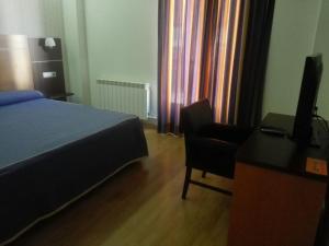 Postel nebo postele na pokoji v ubytování Hotel Alfageme