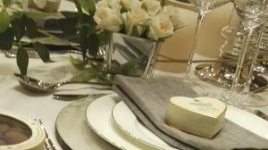 a table with white plates and a plate with a piece of cheese at Blue Palms in Bournemouth