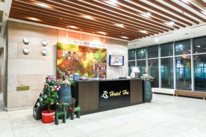 a store front with christmas trees in a mall at Hotel Hu Incheon Airport in Incheon