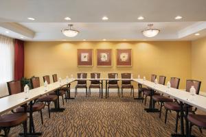 a conference room with a long table and chairs at Country Inn & Suites By Radisson, Atlanta Airport North, GA in Atlanta