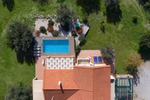an aerial view of a house with a swimming pool at Olive Private Villa up to 12 in Kolymbia +36 photos