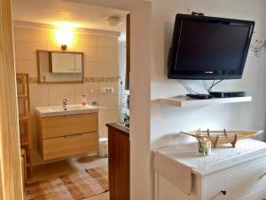 TV a/nebo společenská místnost v ubytování Ferienwohnung Scheib + 15 fotografií
