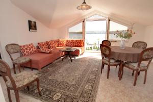 a living room with a couch and a table at Vila Nataly in Trogir