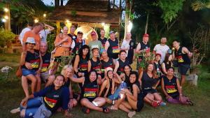 a group of people are posing for a picture at Huan Chiang Dao Resort in Chiang Dao