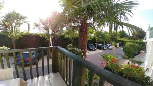 a balcony with cars parked in a parking lot at Hotel Ristorante Fortuna in Cavallino-Treporti