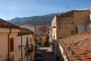 a view of a town with buildings and cars at Il Cortiletto in Castelbuono