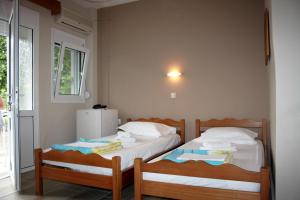Letto o letti in una camera di Ενοικιαζόμενα Δωμάτια Ενιπεύς- Rooms Enipeas