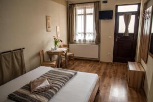 Postel nebo postele na pokoji v ubytování Nádasdi Ház
