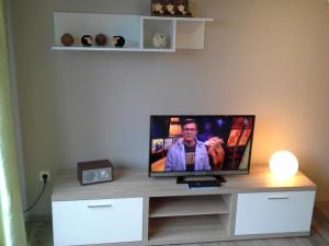 a flat screen tv sitting on top of a table at BUE - Ferienhaus Helmcke in Büsum